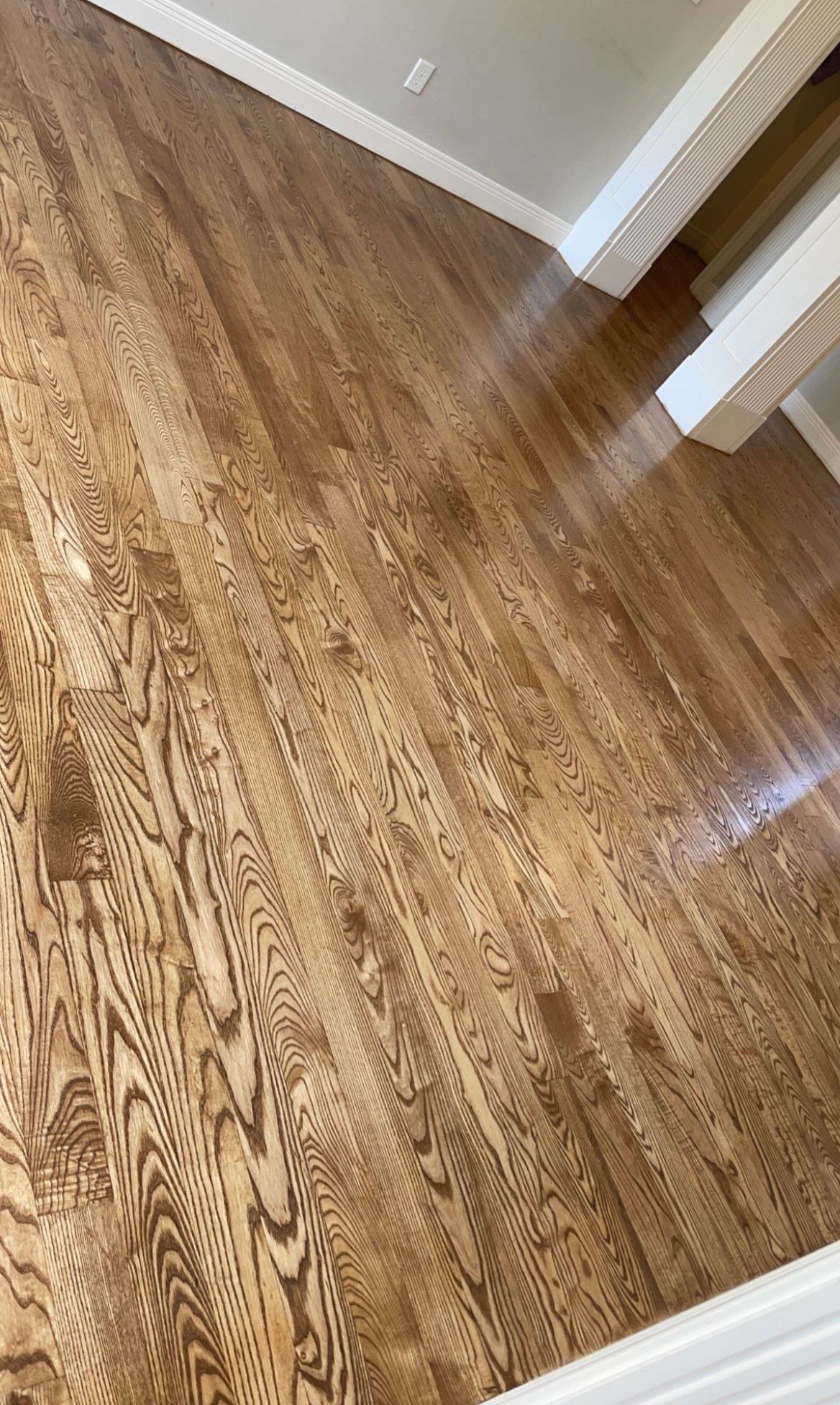 A Wooden Floor In A Room With White Trim | Lexington, KY | Hometown