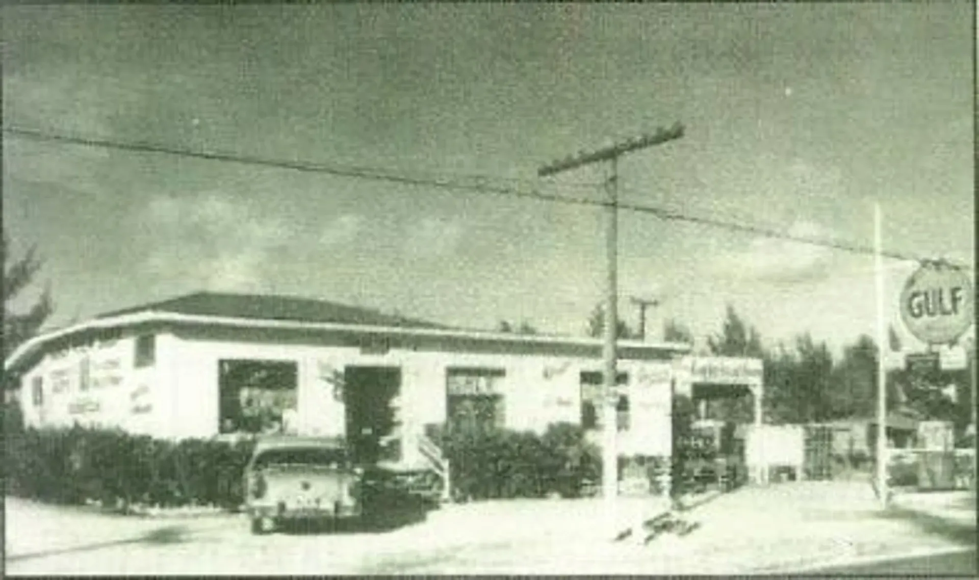 A black and white photo of a gulf gas station