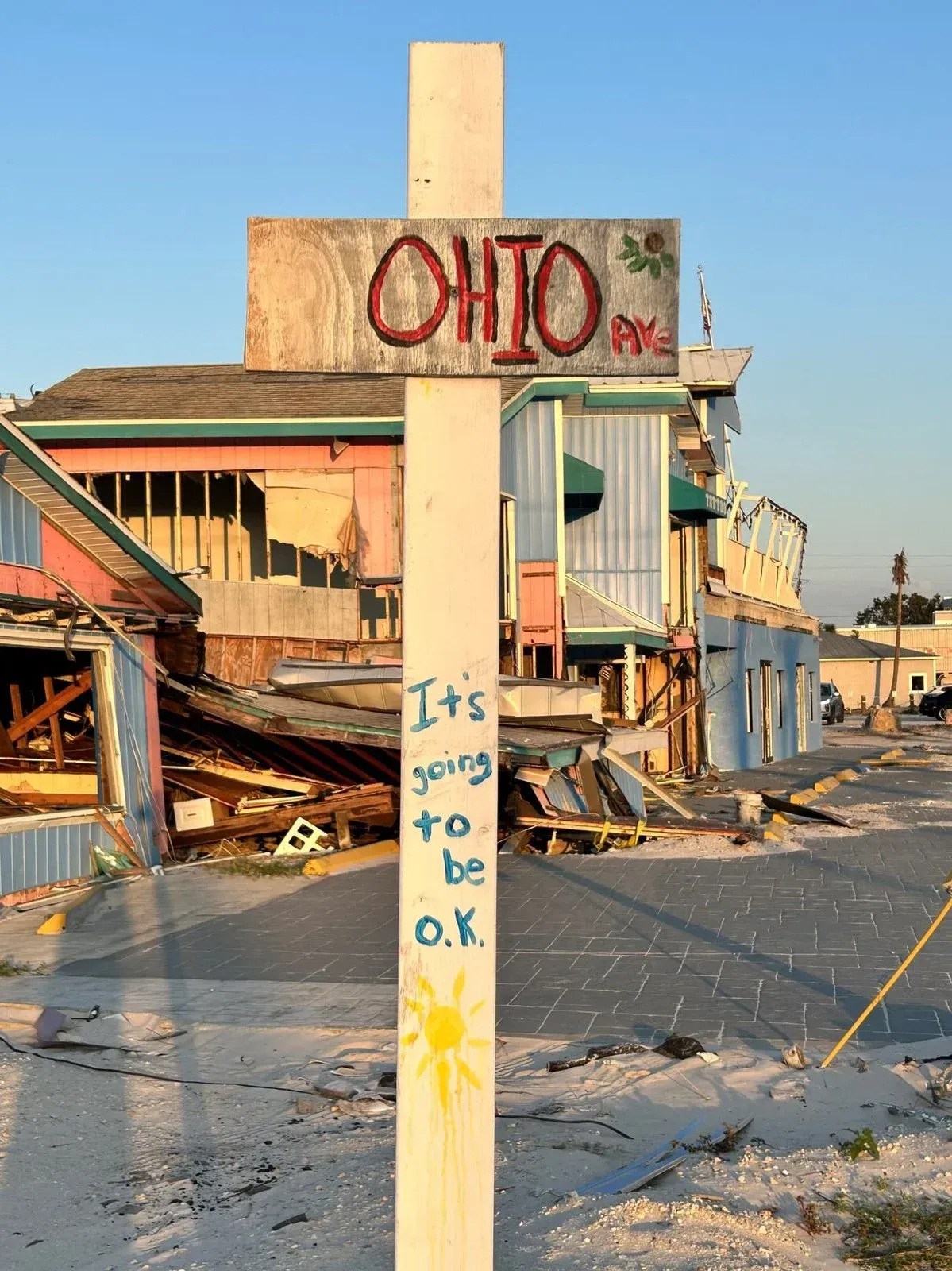A wooden cross with the word ohio on it