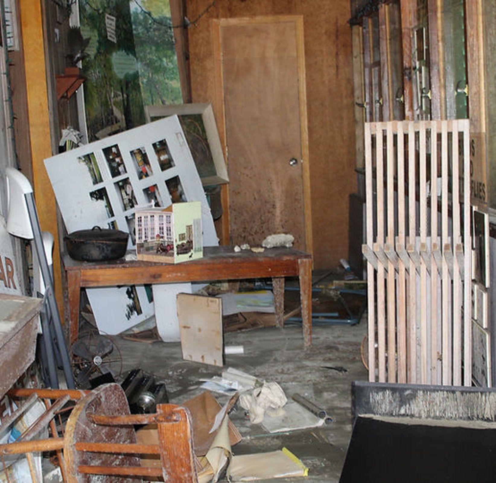 A messy room with a sign that says ' a ' on it