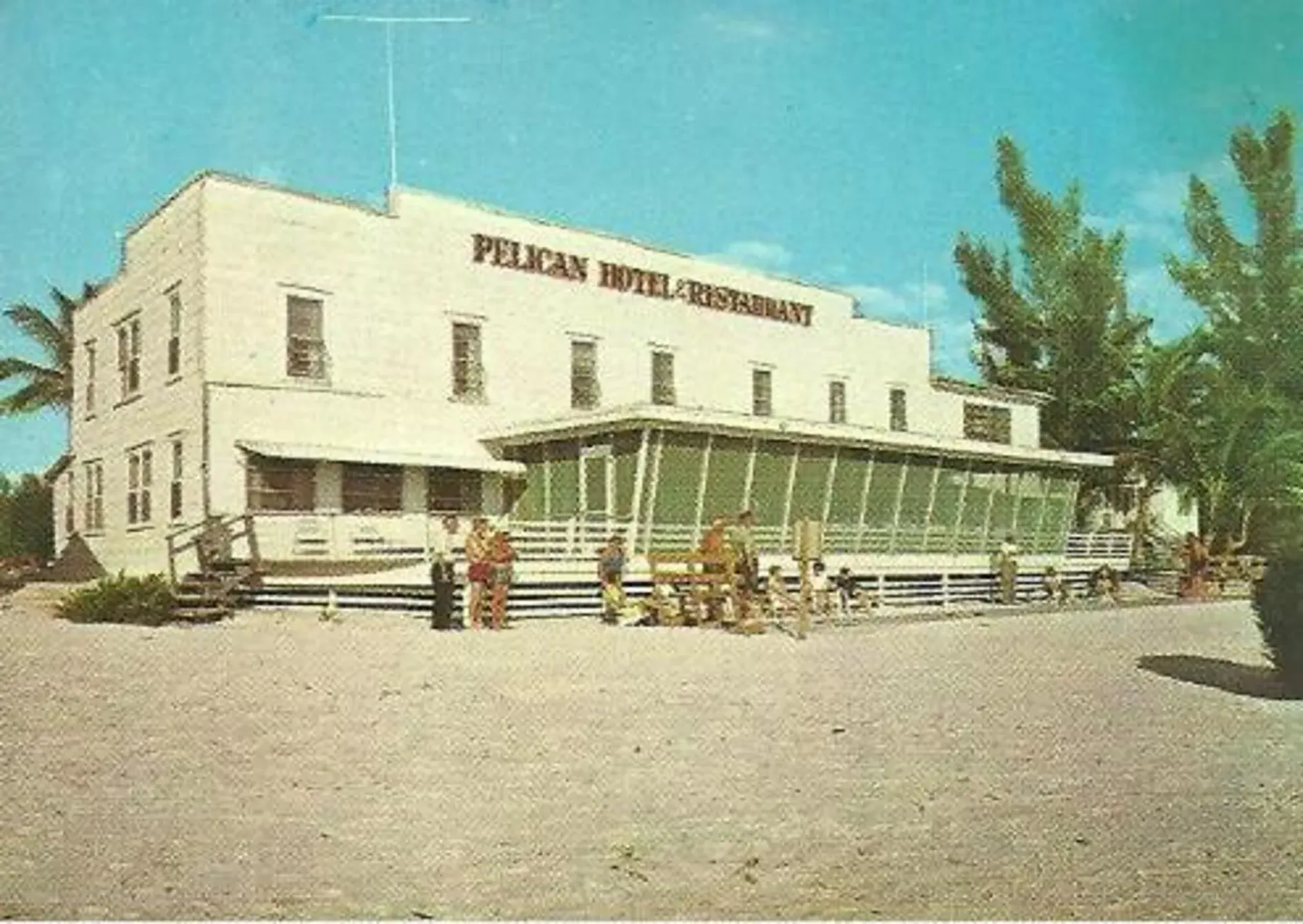 A large white building with the word pelican on it