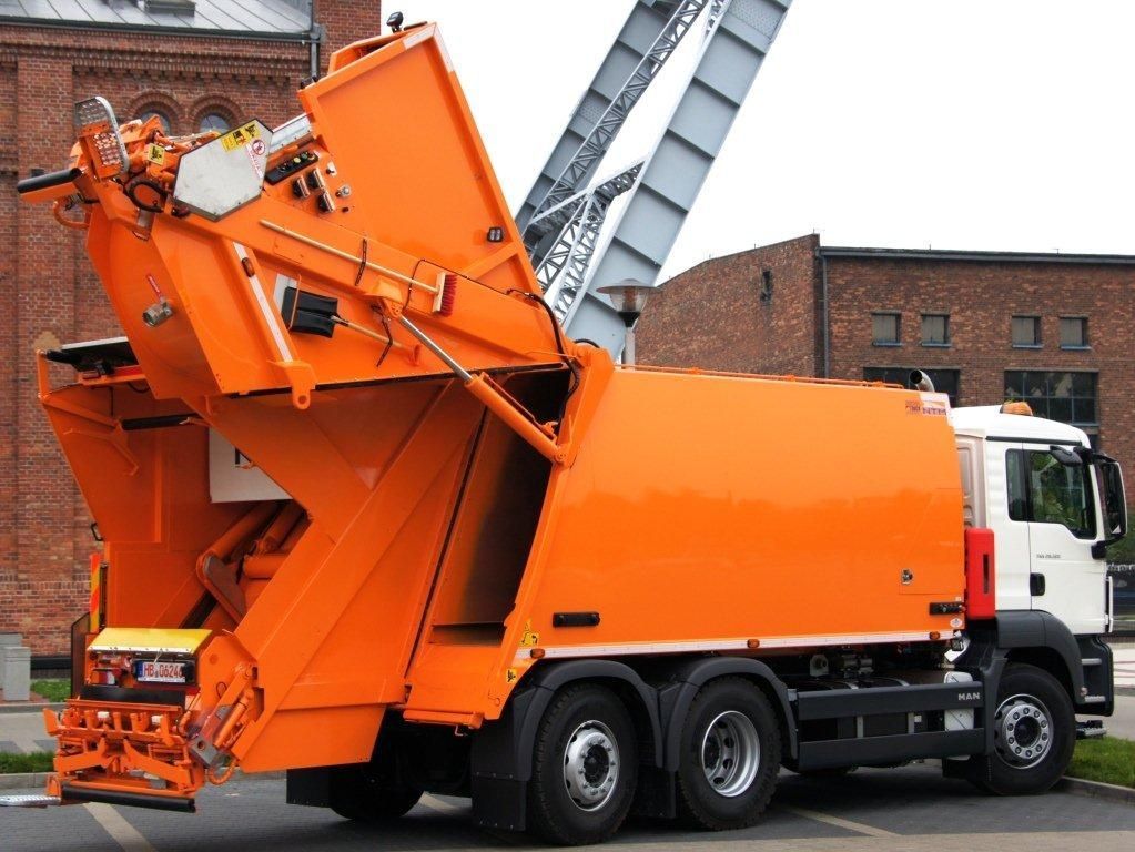 Road construction material supply truck with heavy equipment for infrastructure projects