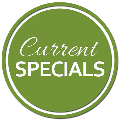 A white, star-shaped sign with a fist holding a hammer breaking through it; set against a red background.