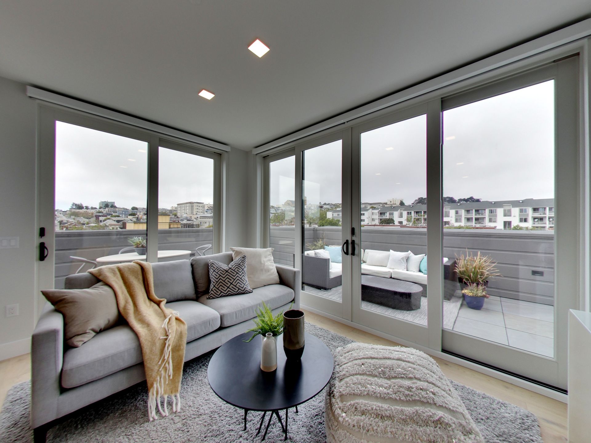 Englander Residences - Living room with large windows