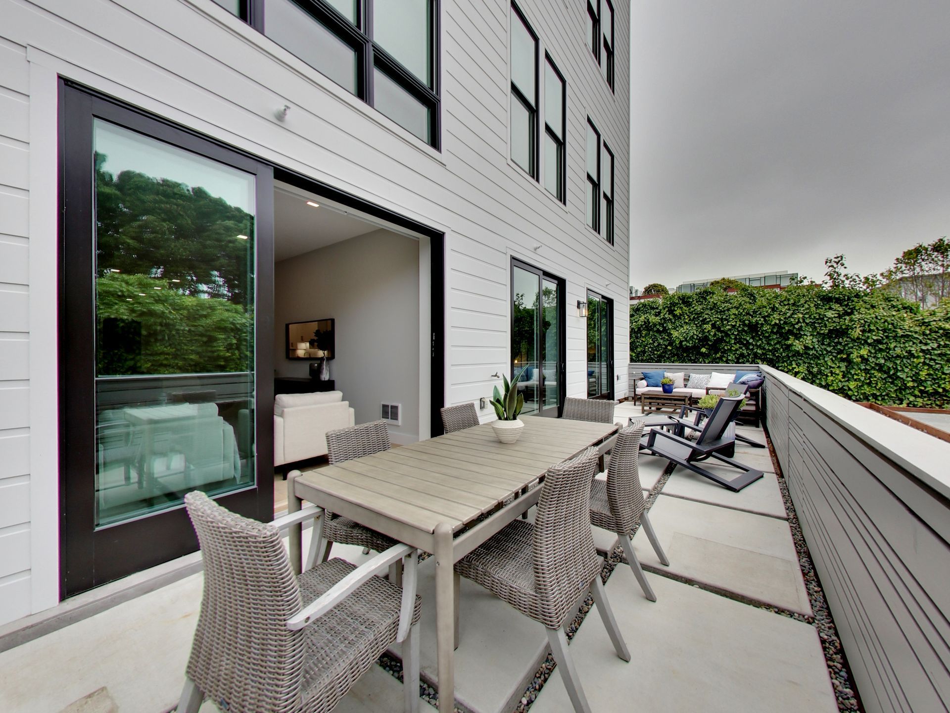 Englander Residences - Private patio with table set