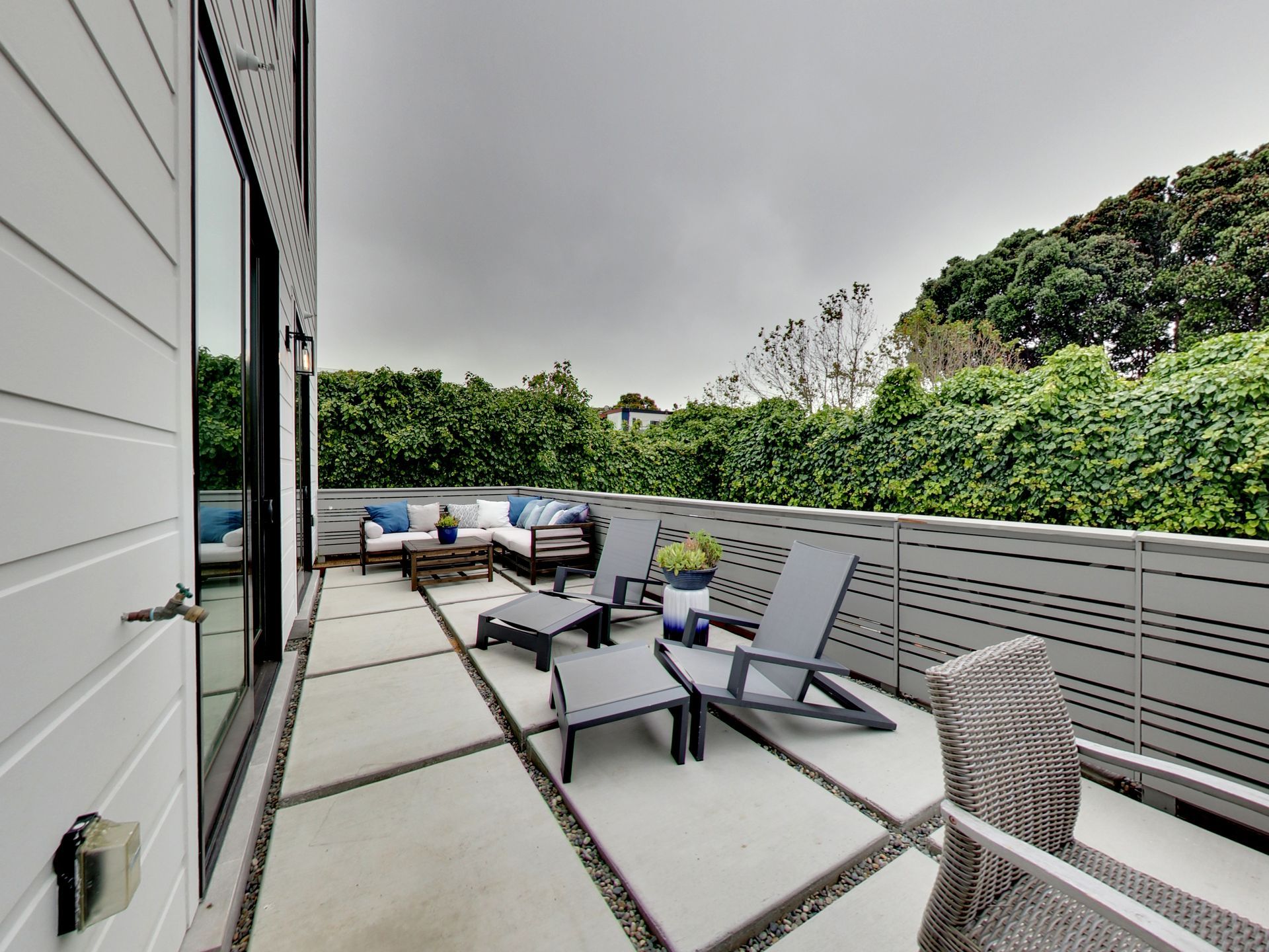 Englander Residences - Private patio with chairs