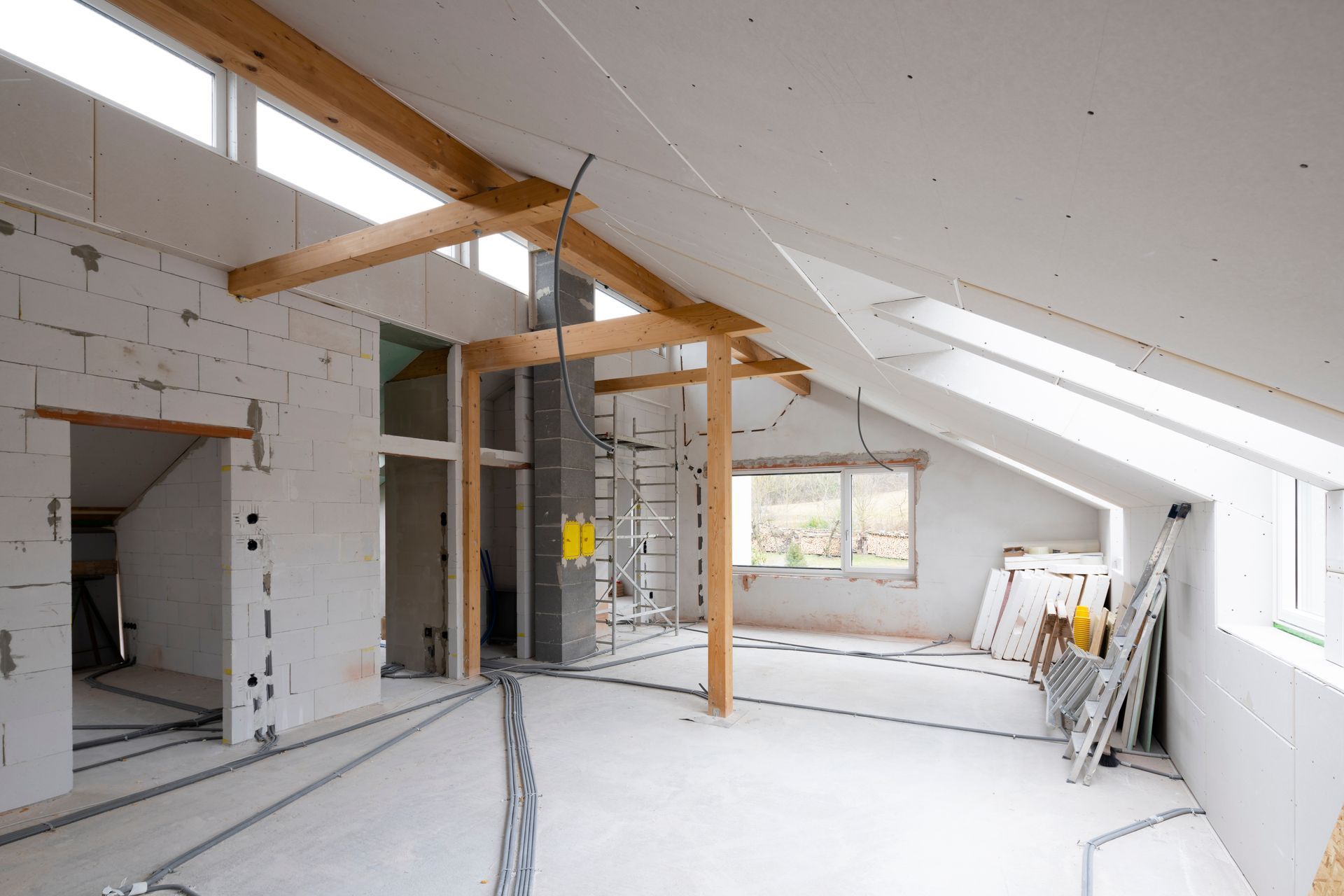 An attic with windows on construction