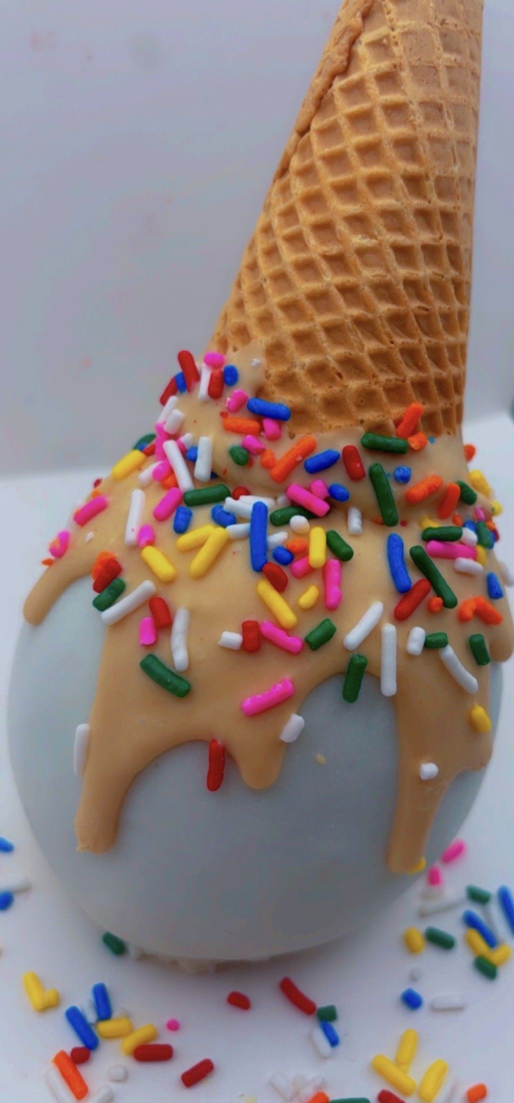 Assortment of decorated cookies, including chocolate-covered, crescent, and star-shaped, in a box.