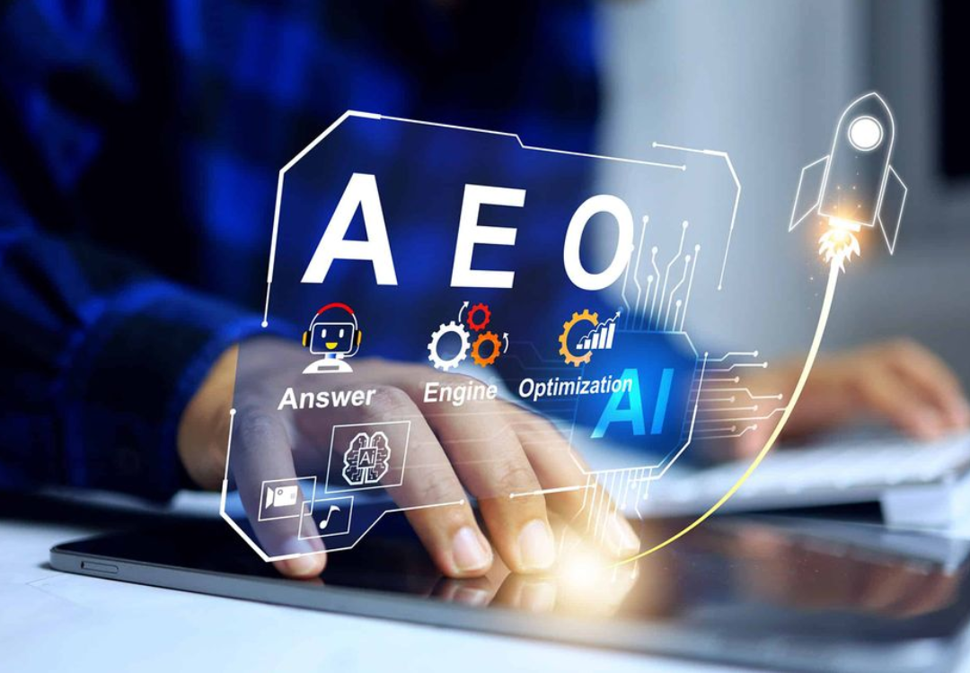 Person using a smartphone with email icons overlaying, near an open laptop in a cafe.