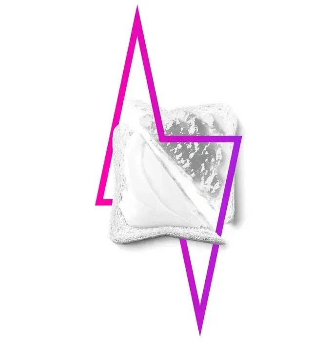 Bread with white spread, overlaid with a magenta lightning bolt shape.