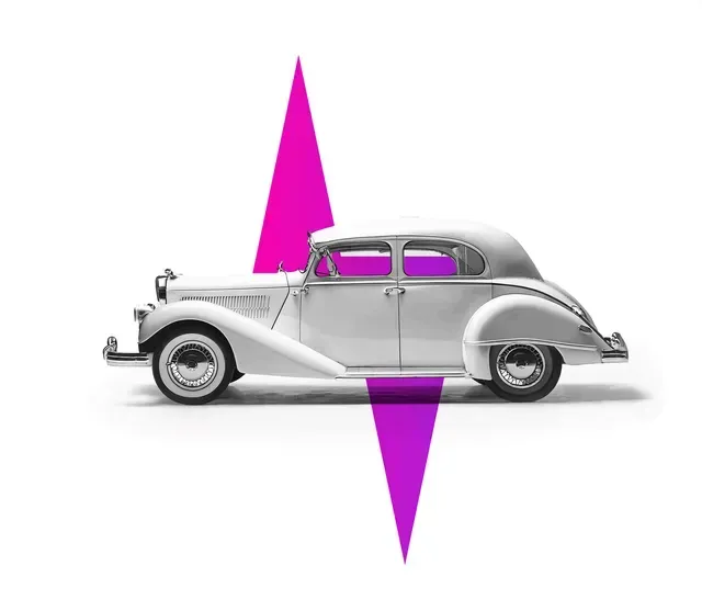 White vintage car with purple arrow pointing up and down.