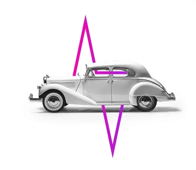 Classic white car with a pink upside-down 