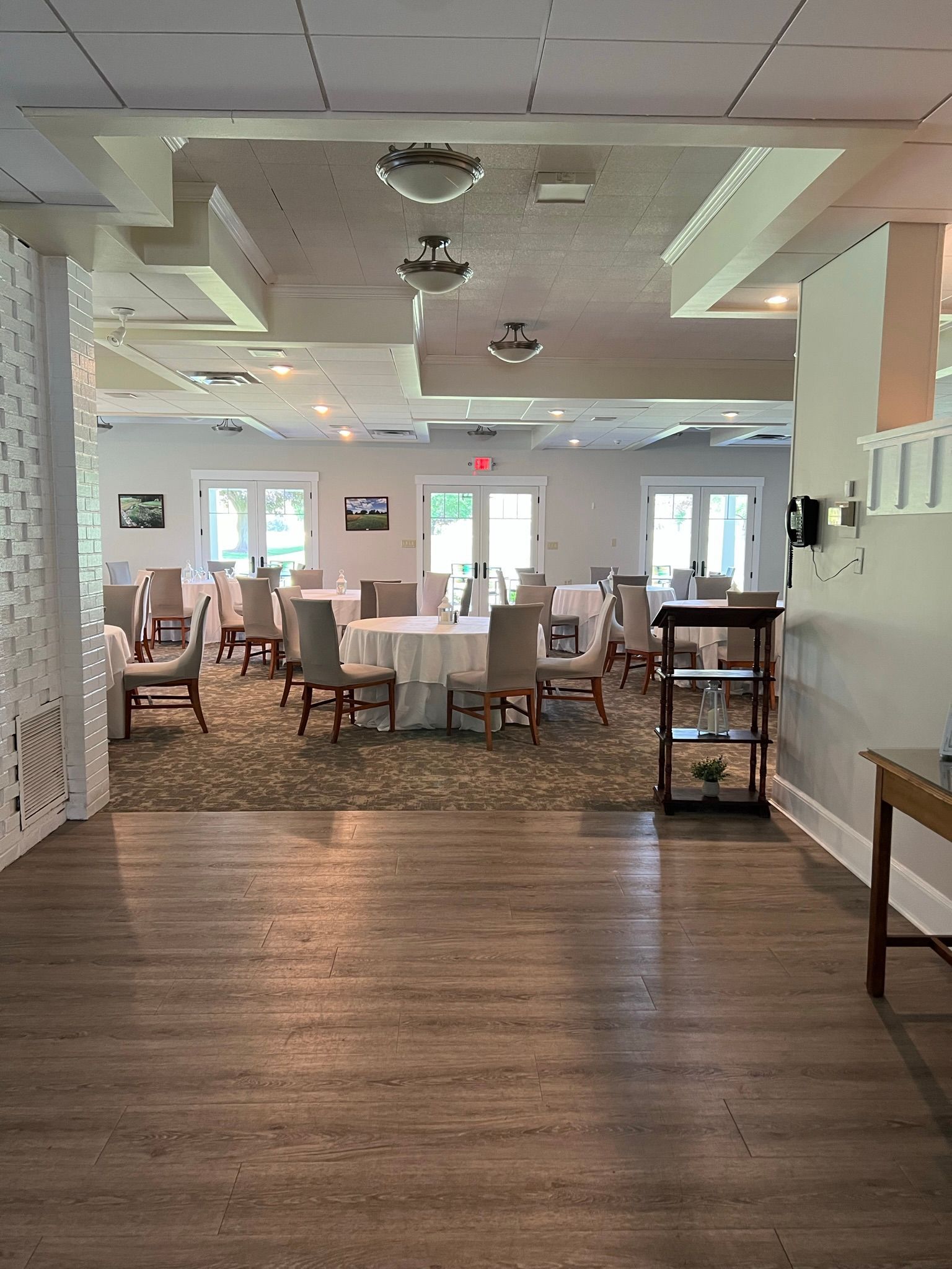 A large room with tables and chairs in it