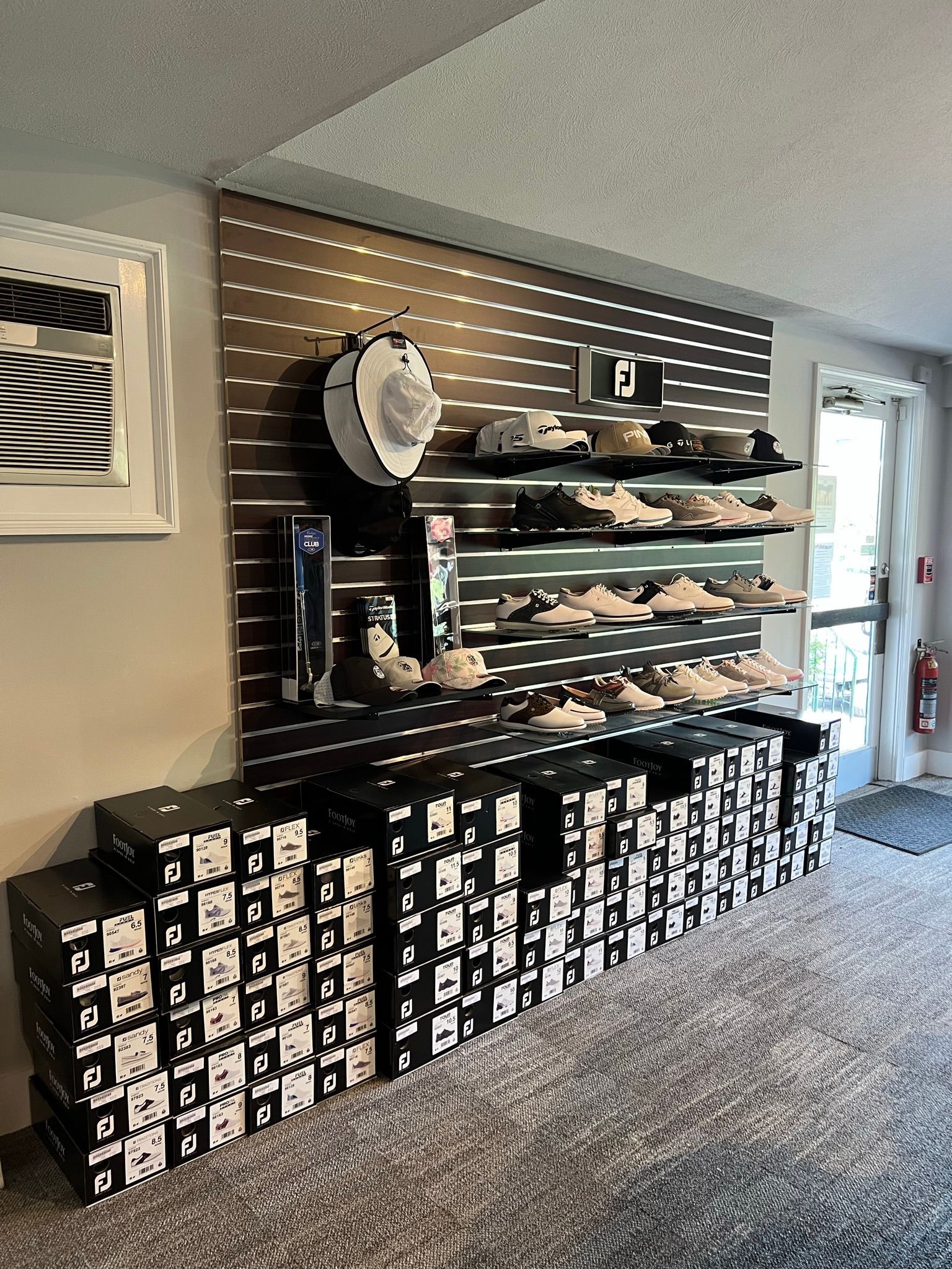 A store filled with lots of shoes and hats.