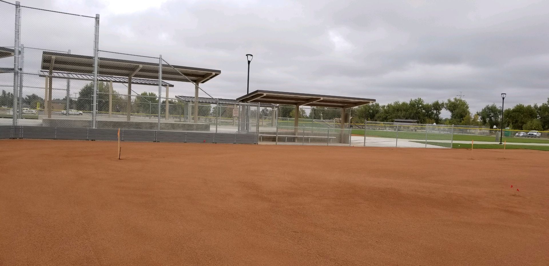 An empty baseball field with a fence buit by Greater Western  Fence