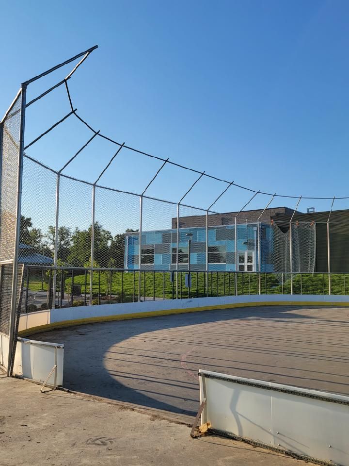 A baseball field with a fence buit by Greater Western Fence