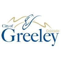 The city of greeley logo is a blue and gold logo with a mountain in the background.