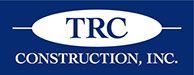 A blue and white logo for trc construction inc.