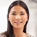 Woman with long dark hair smiles