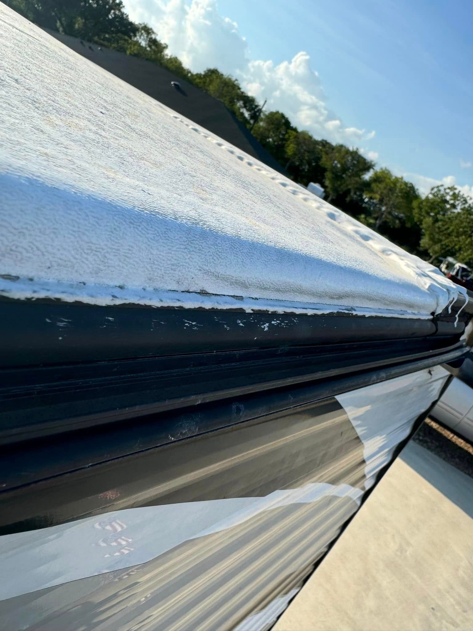 A close up of a roof with a lot of snow on it.