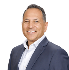 Man in navy suit, white shirt, smiling against a white background. Profitability Consultant helping Local Restaurants