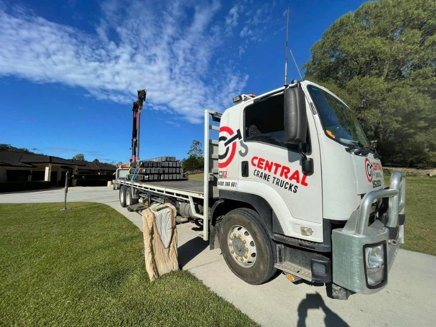 White Truck Parked on a Driveway With a Load — Central Crane Trucks In Brisbane, QLD