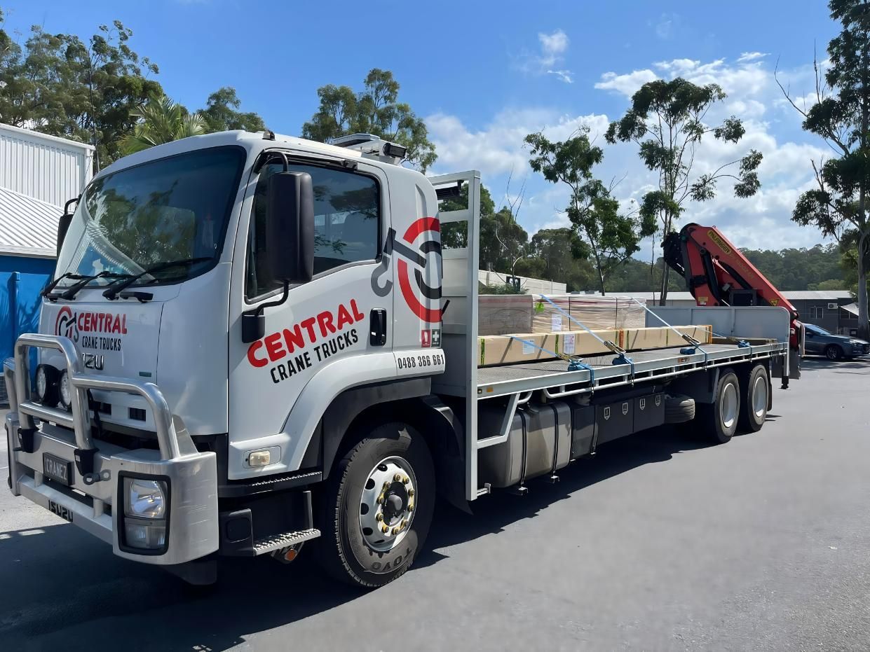 A White Truck With the Word Central on the Side is Parked on the Side of the Road — Central Crane Trucks In Brisbane, QLD