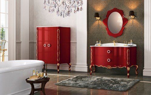 un bagno con una vasca, una cassettiera e un mobile da lavabo di color rosso
