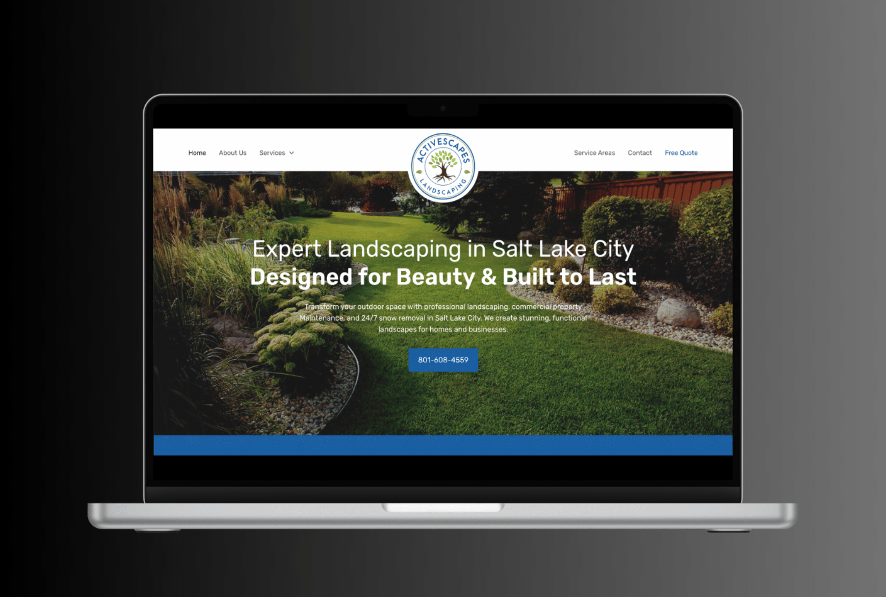 A laptop computer is open to a website for expert landscaping in salt lake city.