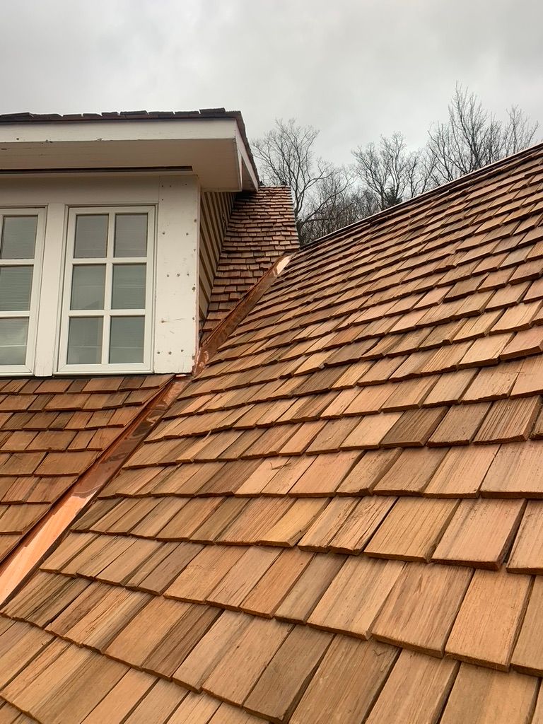 House with wood shingles and copper edging
