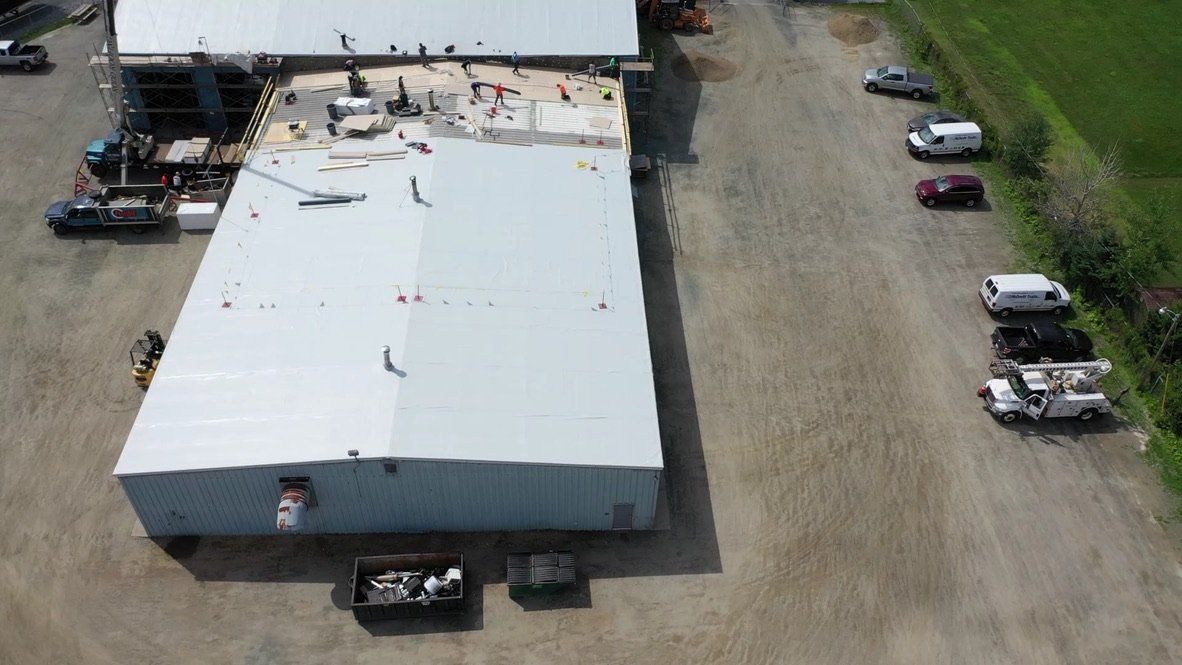 Metal Retrofit project, roof with Rodd Roofing employees