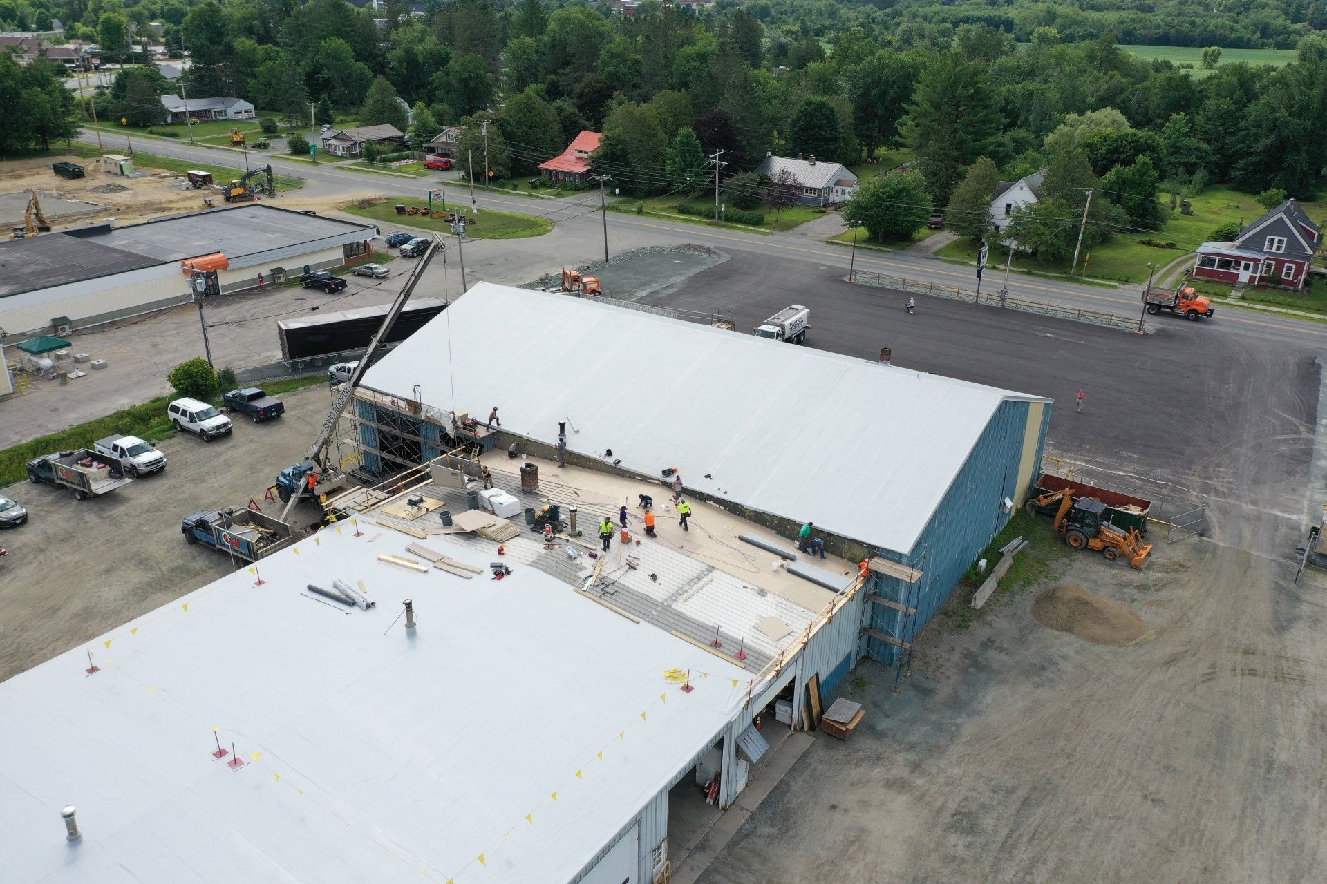 Metal Retrofit project, Rodd roofing employees prepping the roof
