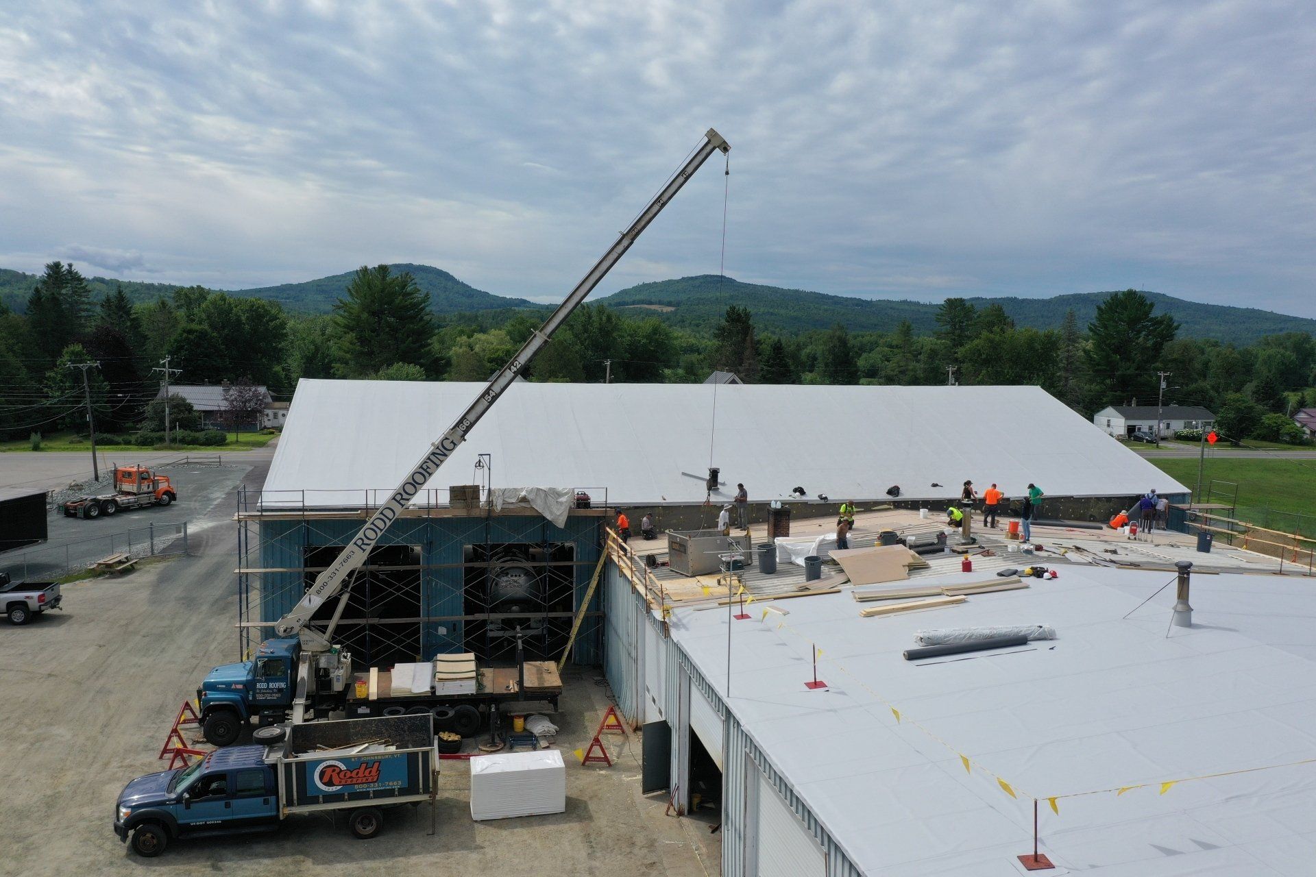 Installation of an Energy-Efficient Metal Roof on a commercial building, showcasing sustainability.