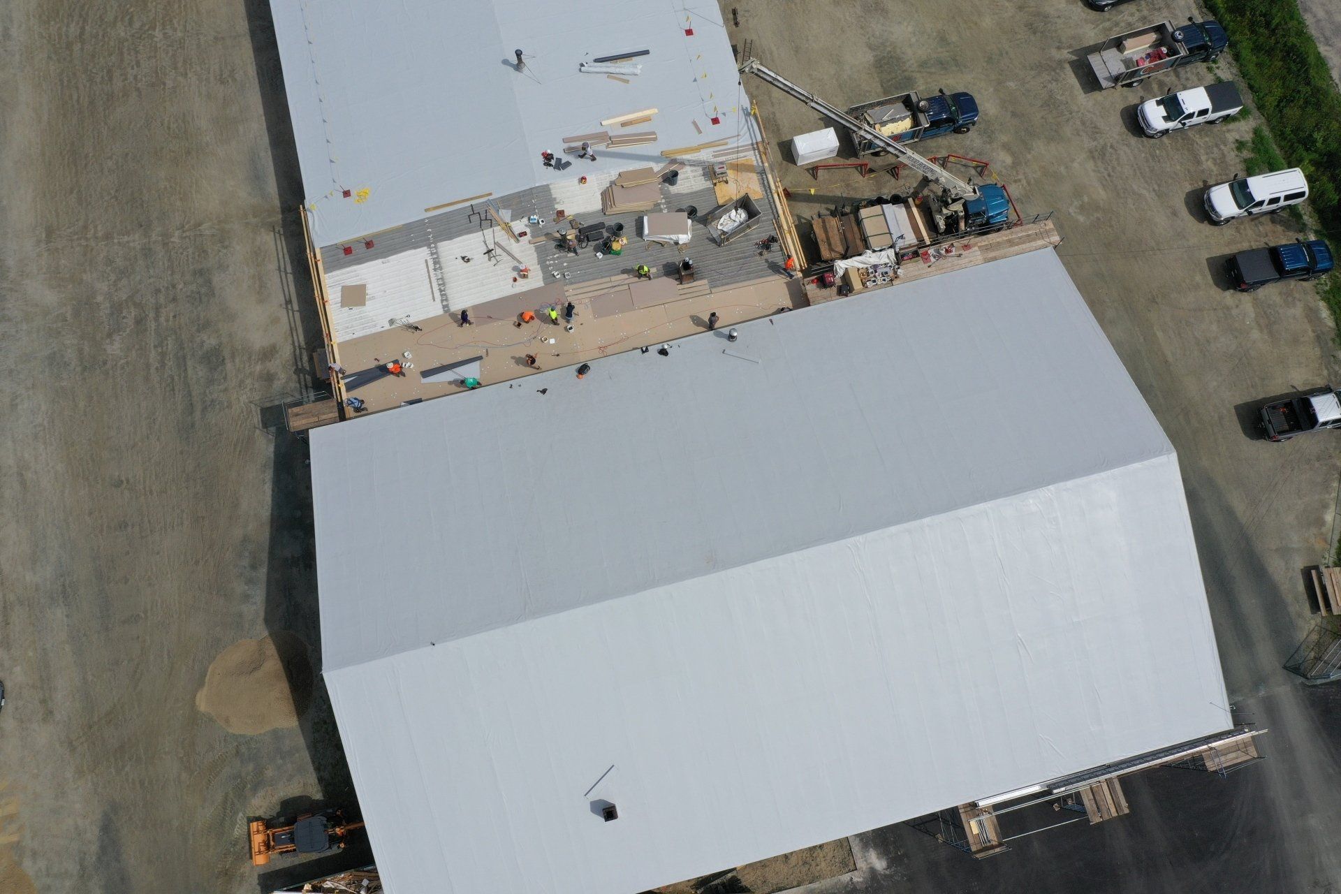 Aerial view of a Metal Roof Retrofit on a large building, highlighting energy-efficient solutions.