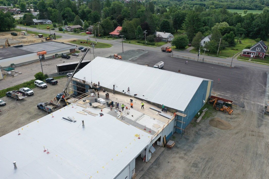 Efficient Metal Roof Retrofit in action, showcasing a sustainable roofing system upgrade.