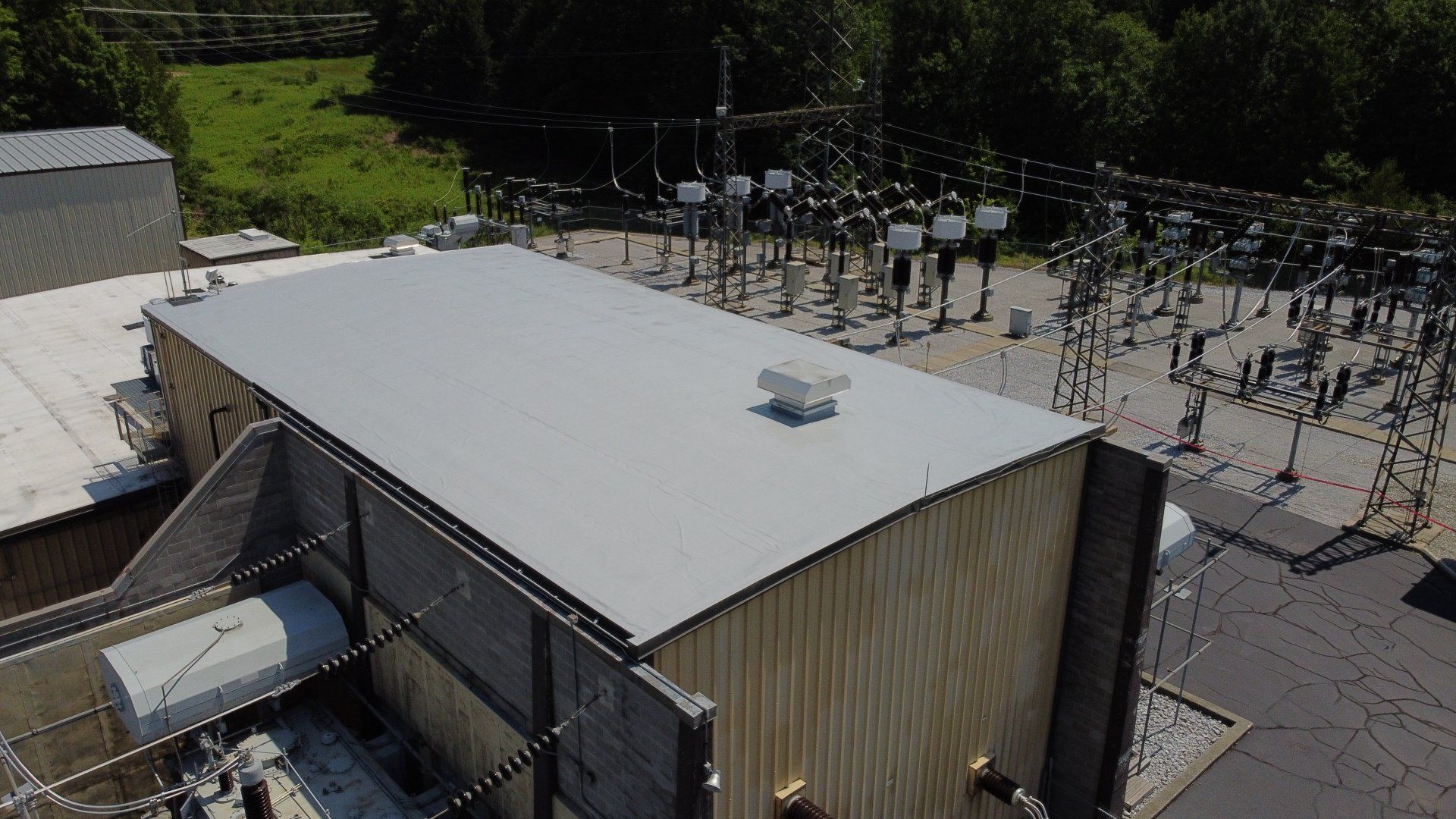 An aerial view of a building with a roof that has been painted white.