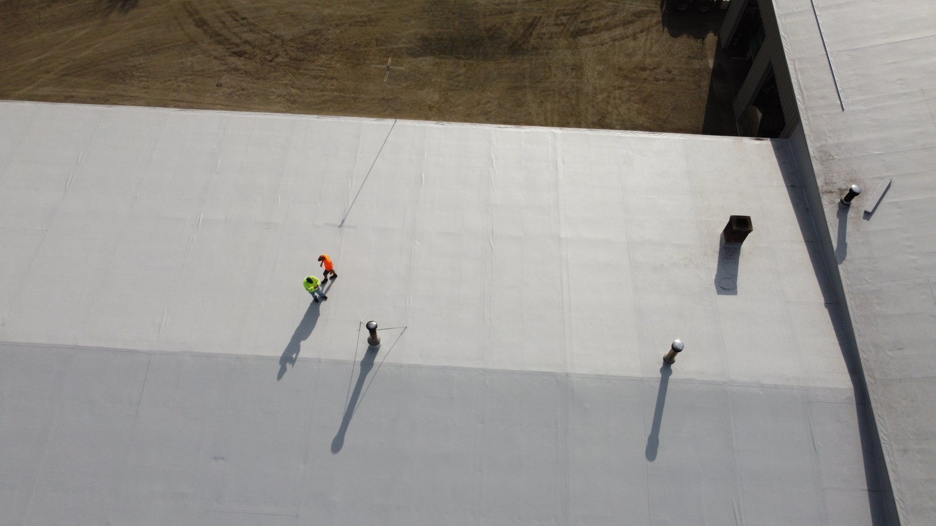 Rodd Roofing specialist conducting a metal retrofit project on a large industrial roof.