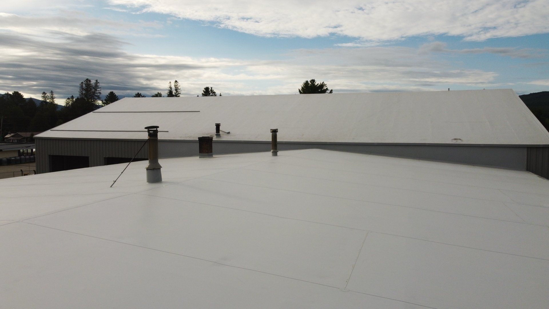Rodd Roofing: Completed metal retrofit roof from above