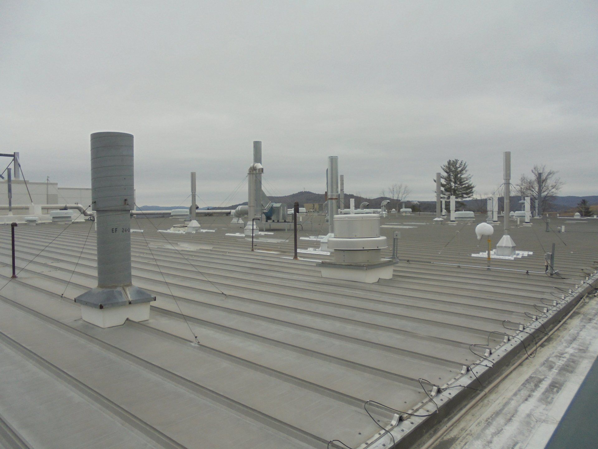 A roof with a lot of chimneys on it