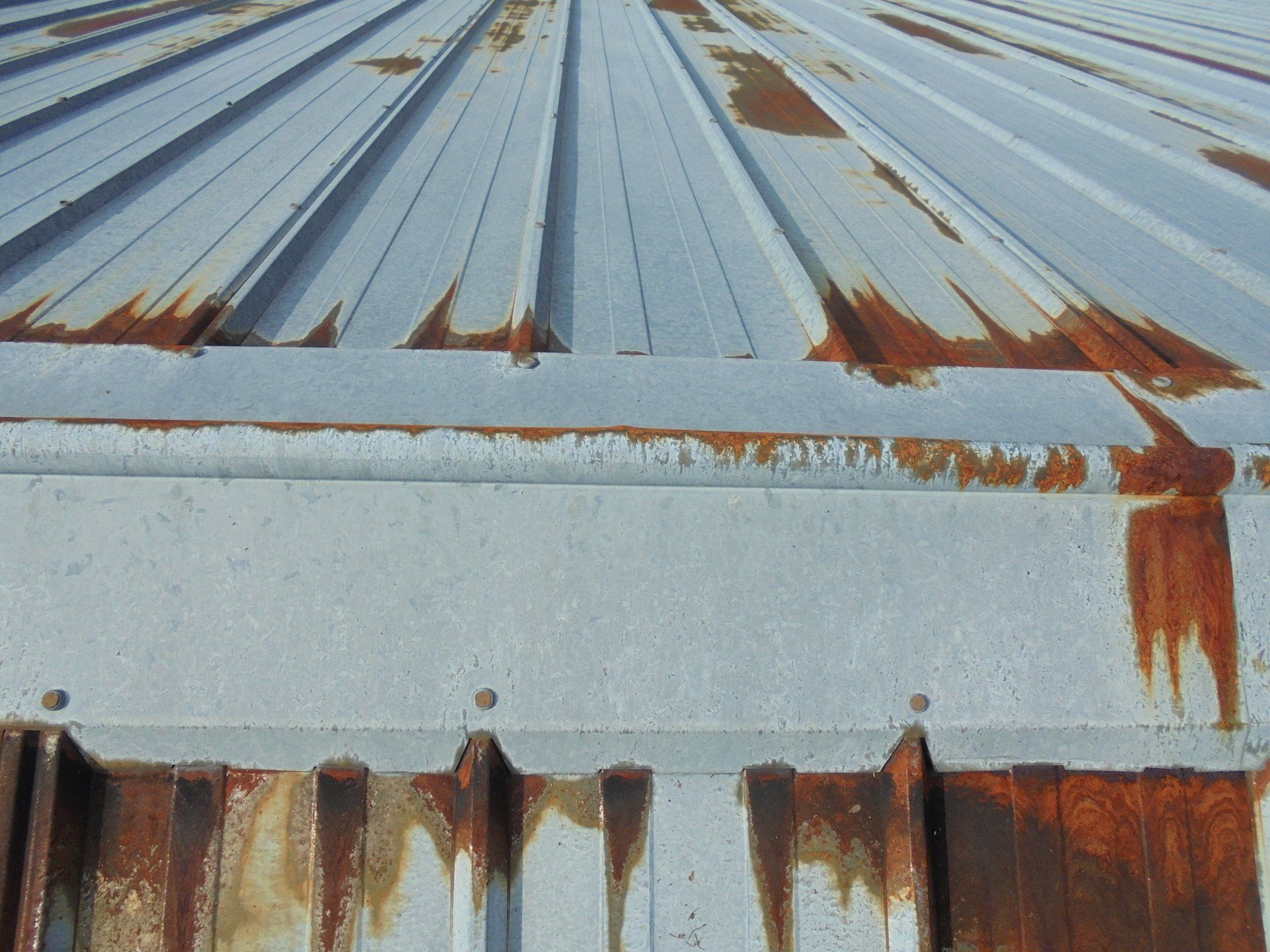 A close up of a rusty metal roof