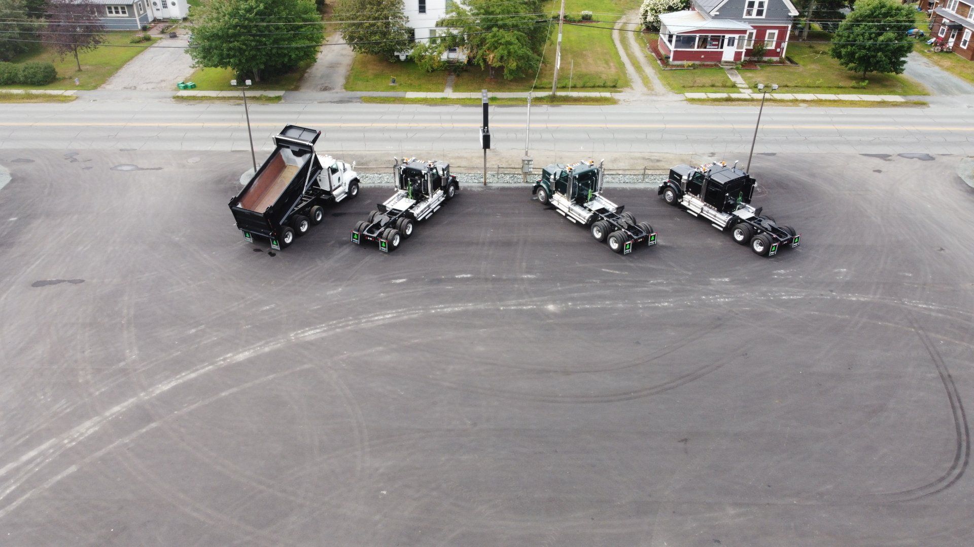 Metal Retrofit project, parking lot showing the dump trucks
