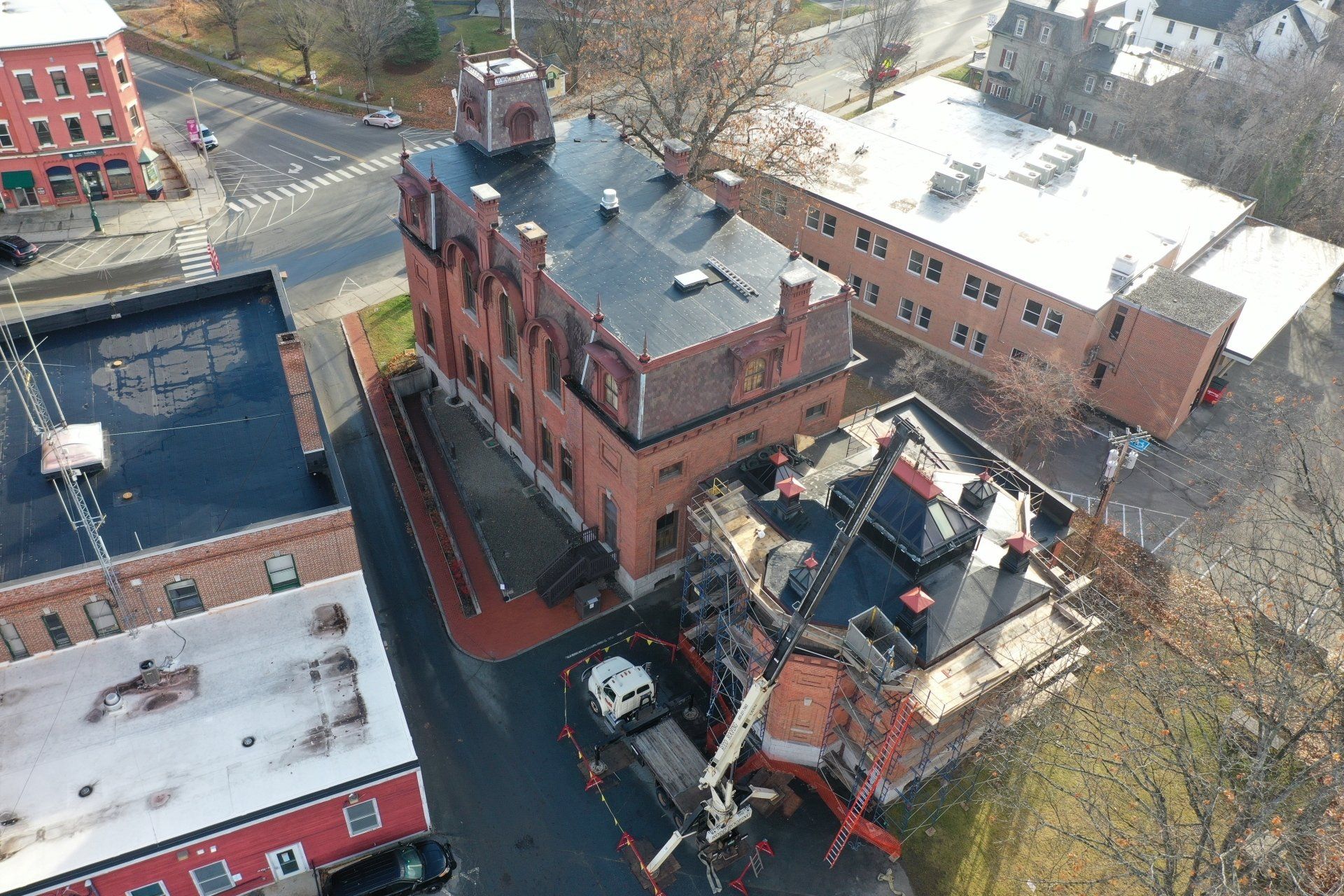 Photo of roofers working on roof at St. Johnsbury Athenaeum in Vermont