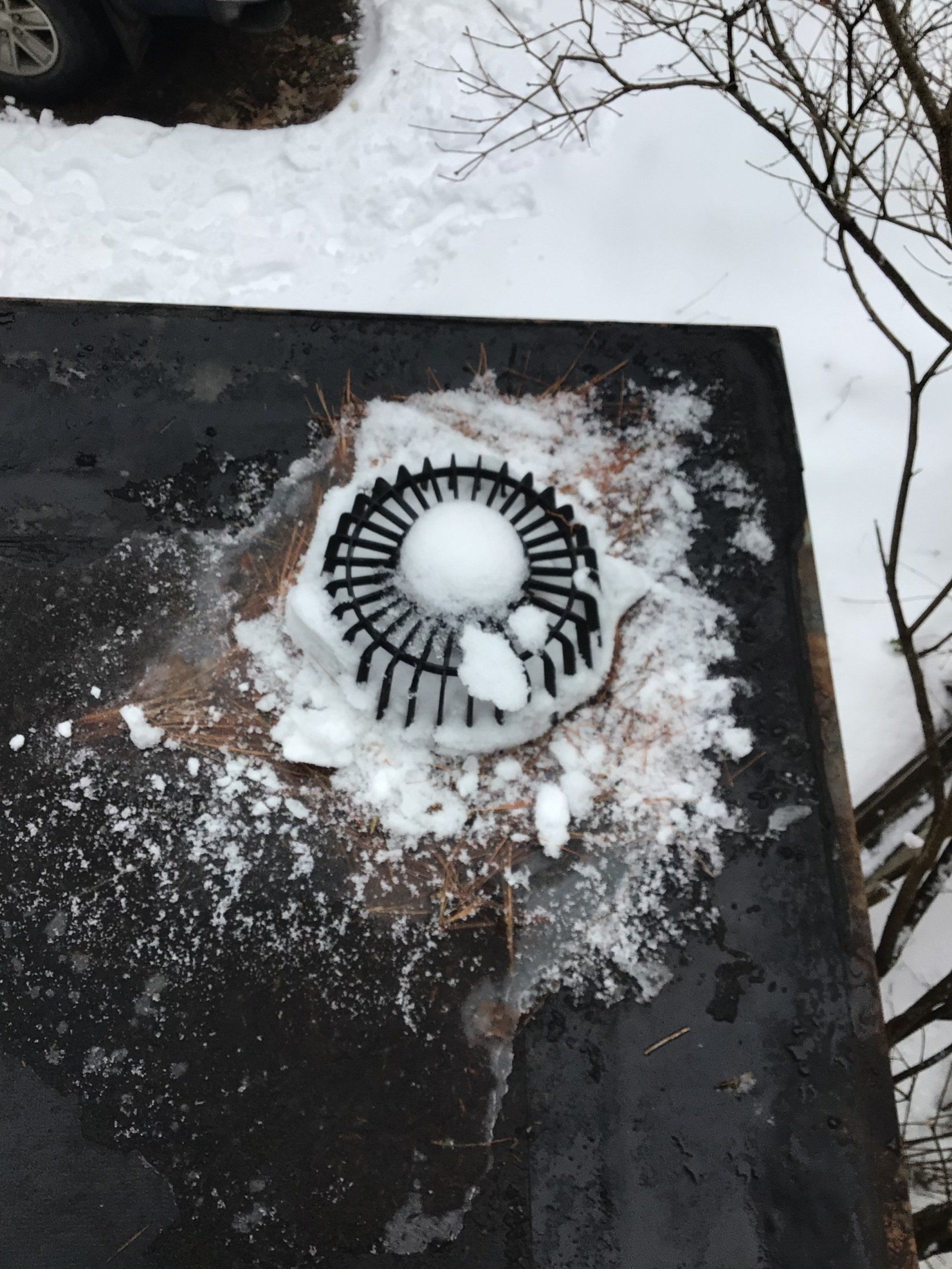 An ice dam on a commercial roof in Vermont