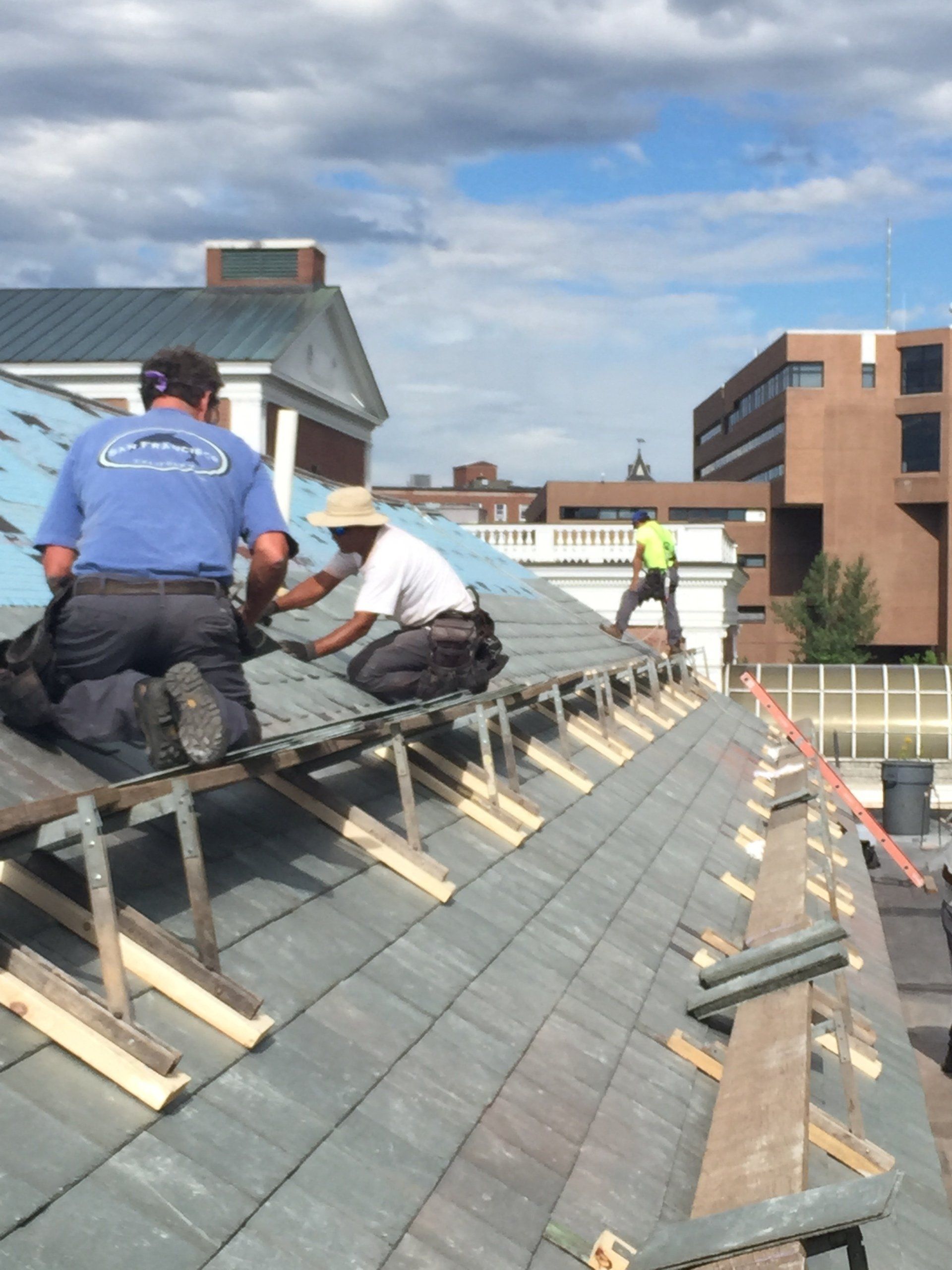 Vermont slate roofer company Rodd Roofing installs a slate shingle roof on a commercial building in Burlington, Vermont
