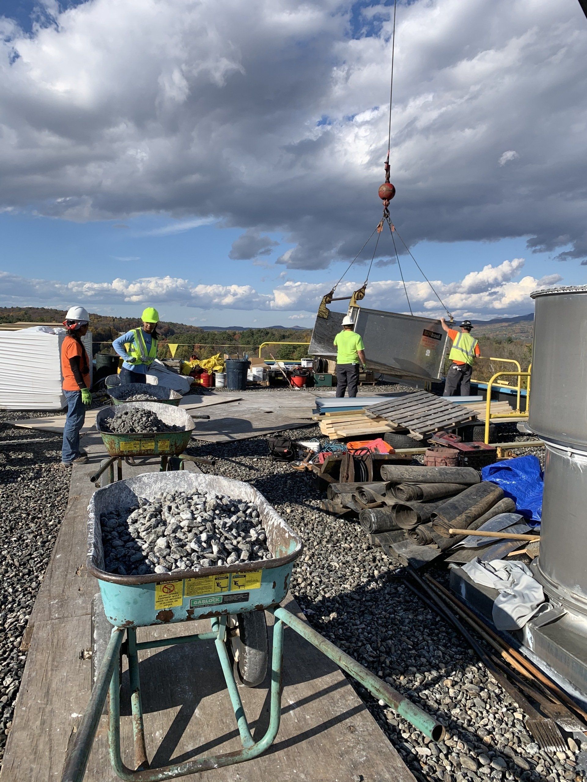 Roof construction crew working on an industrial roof