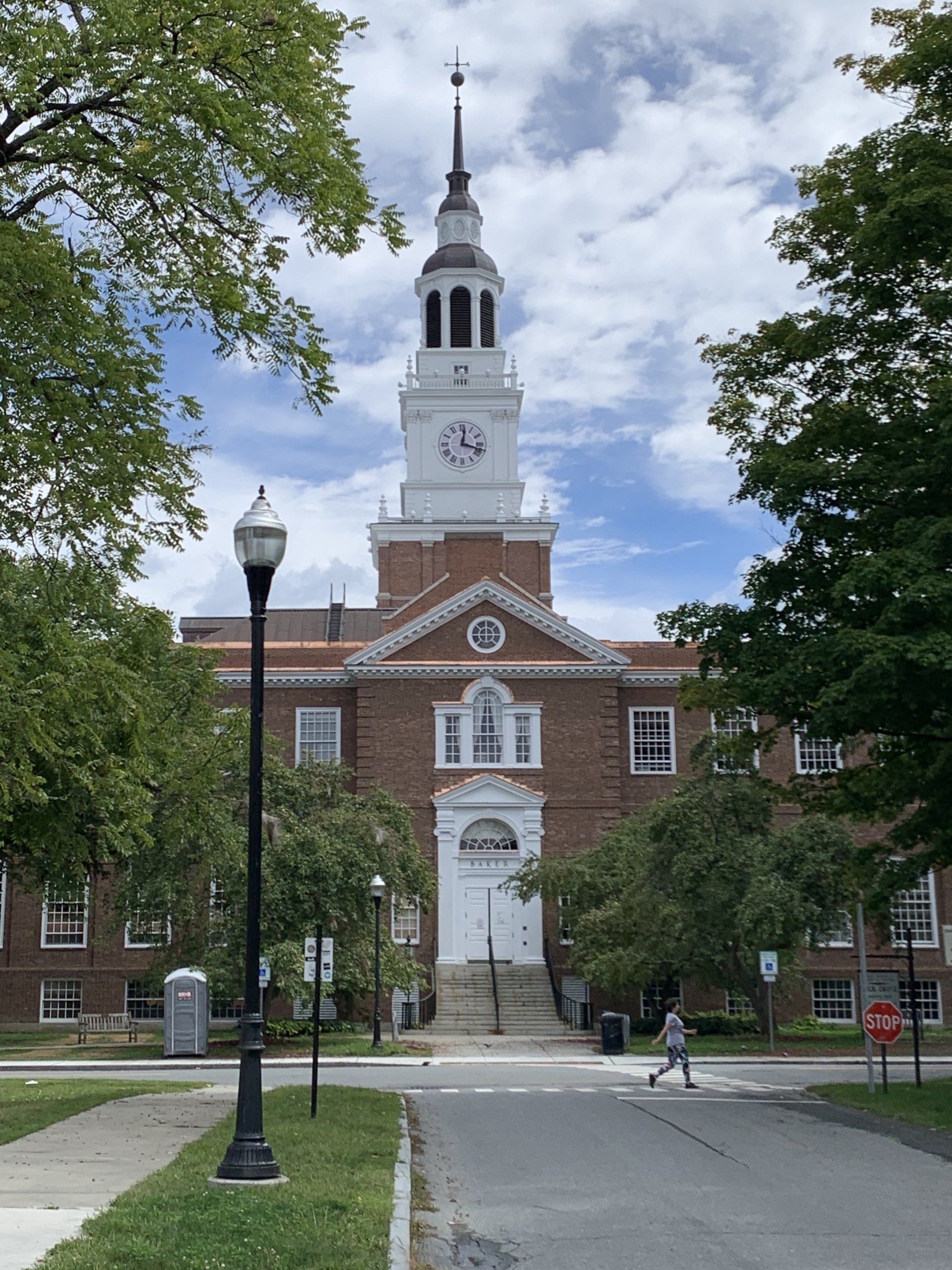 Large brick building with a copper trimmed roof