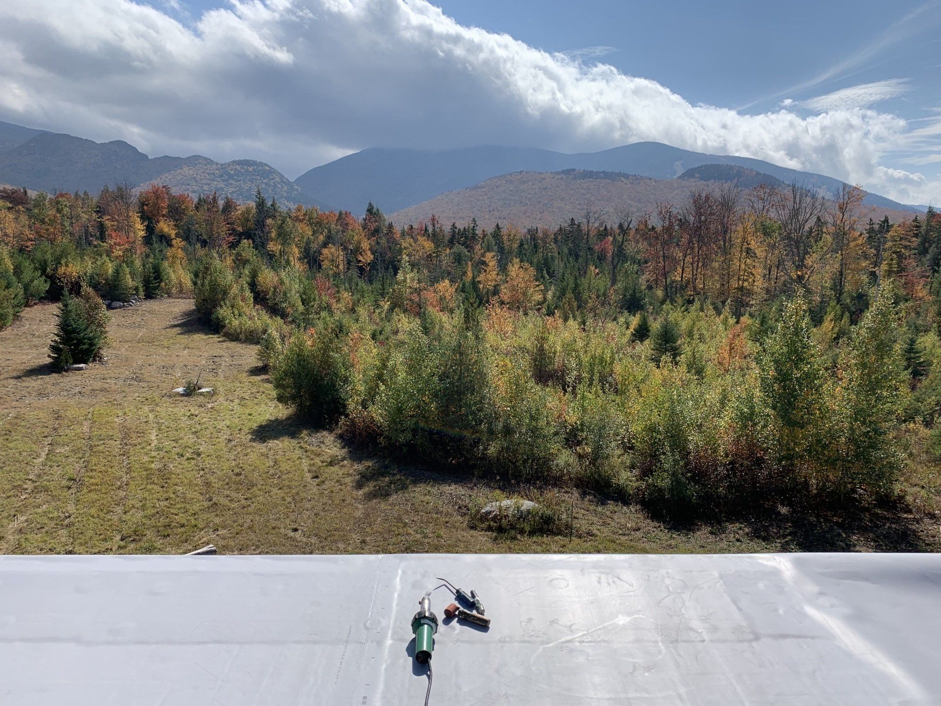 View of mountains in the fall from the top of a roof