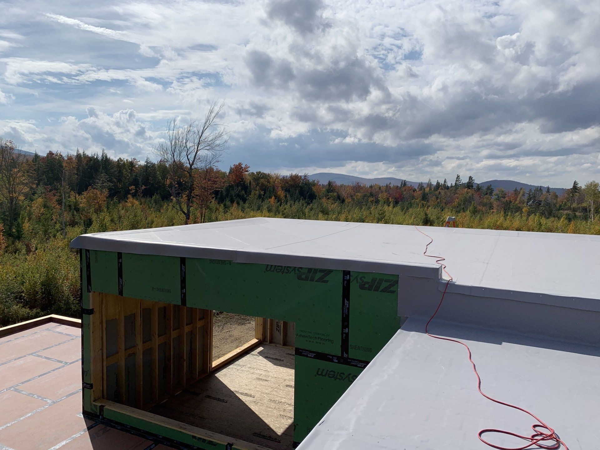 A flat roof installed by Rodd Roofing on a house in Vermont.