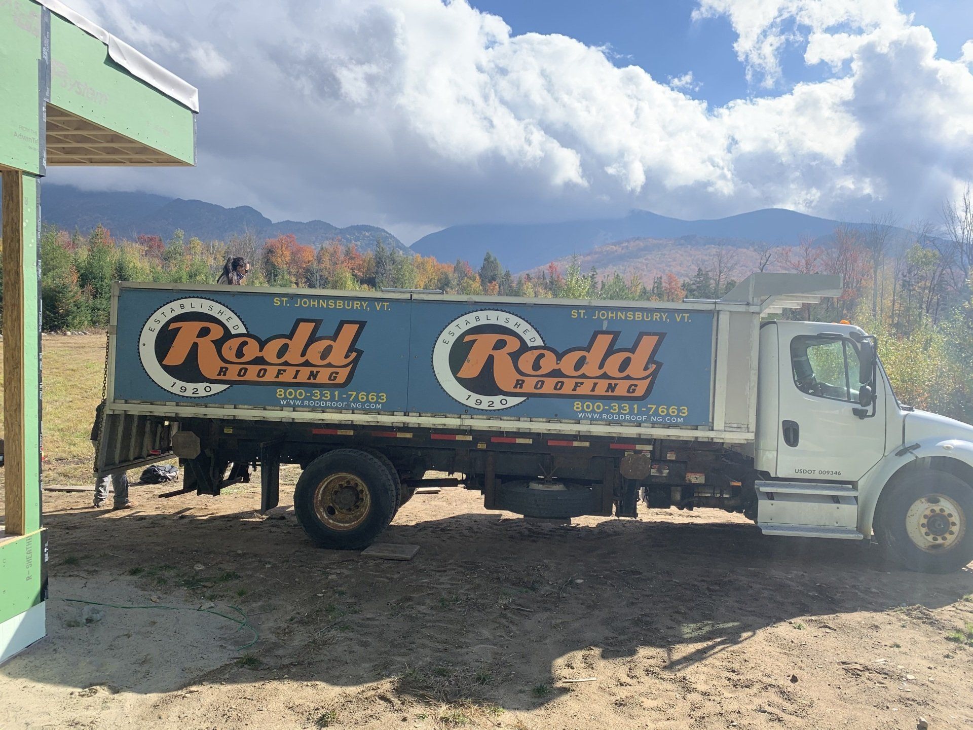 Rodd Roofing, a Vermont Roofing company, pulls up to a job site in a branded truck.
