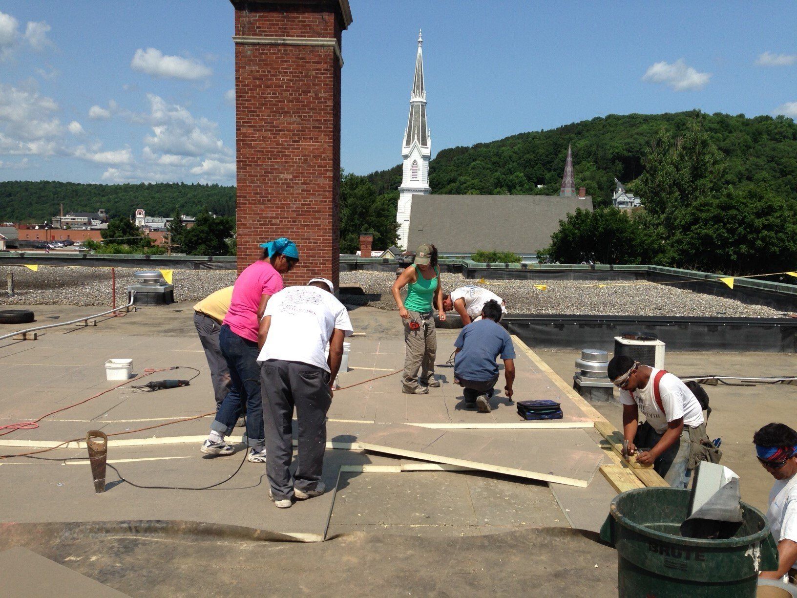 Rodd Roofing: employees preparing a commercial roof for a new single-ply roof